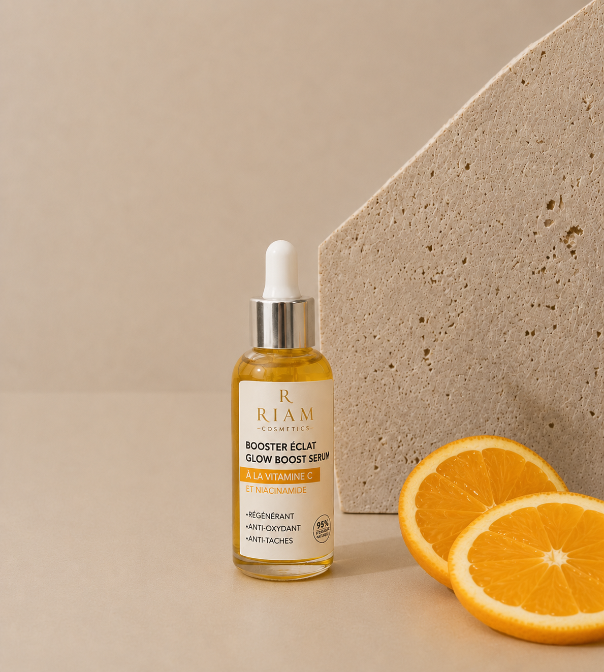 Flacon Duo Serum Riam Cosmetics accompagné de tranches d'orange.